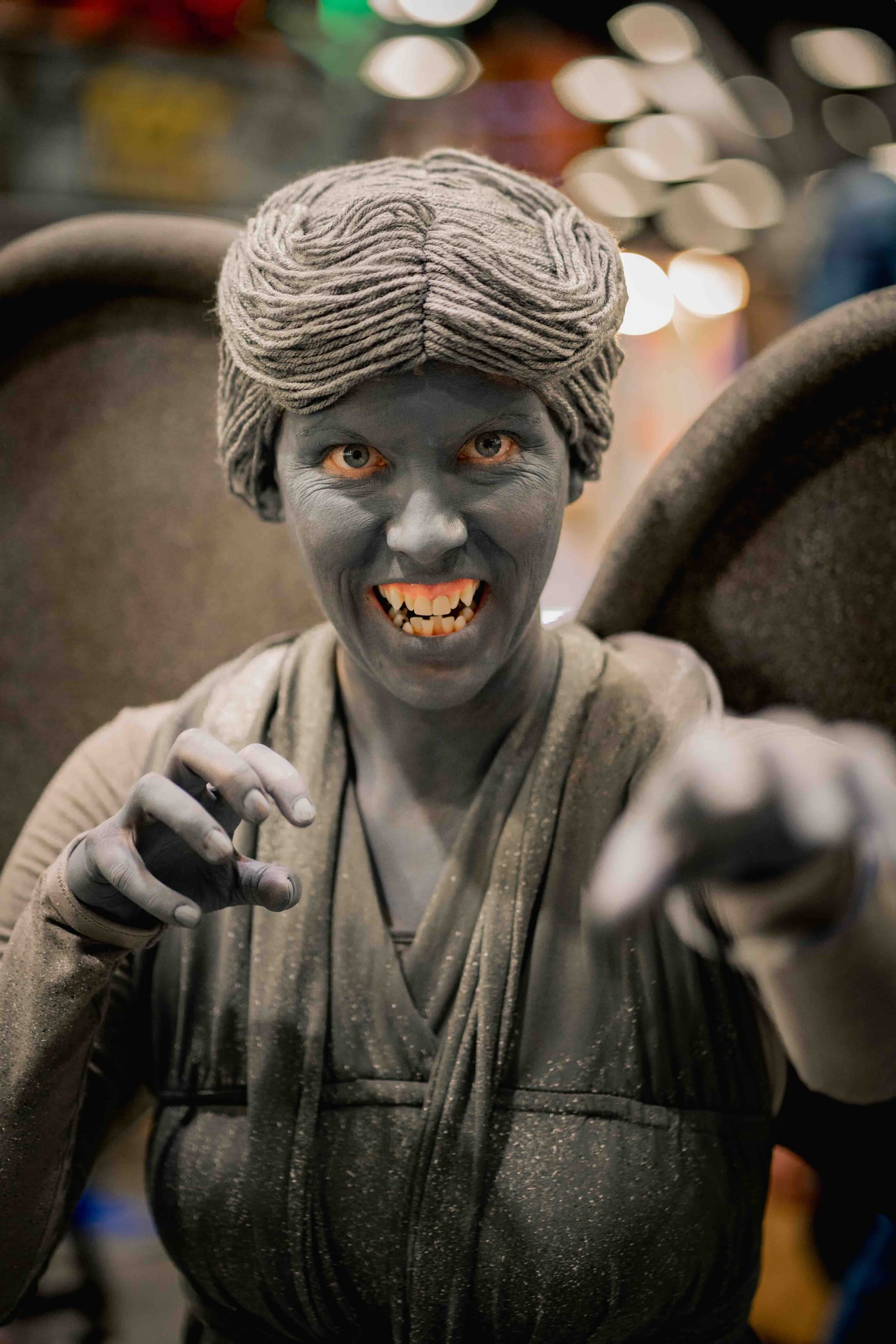 Creative stone demon character with gray body paint and menacing expression