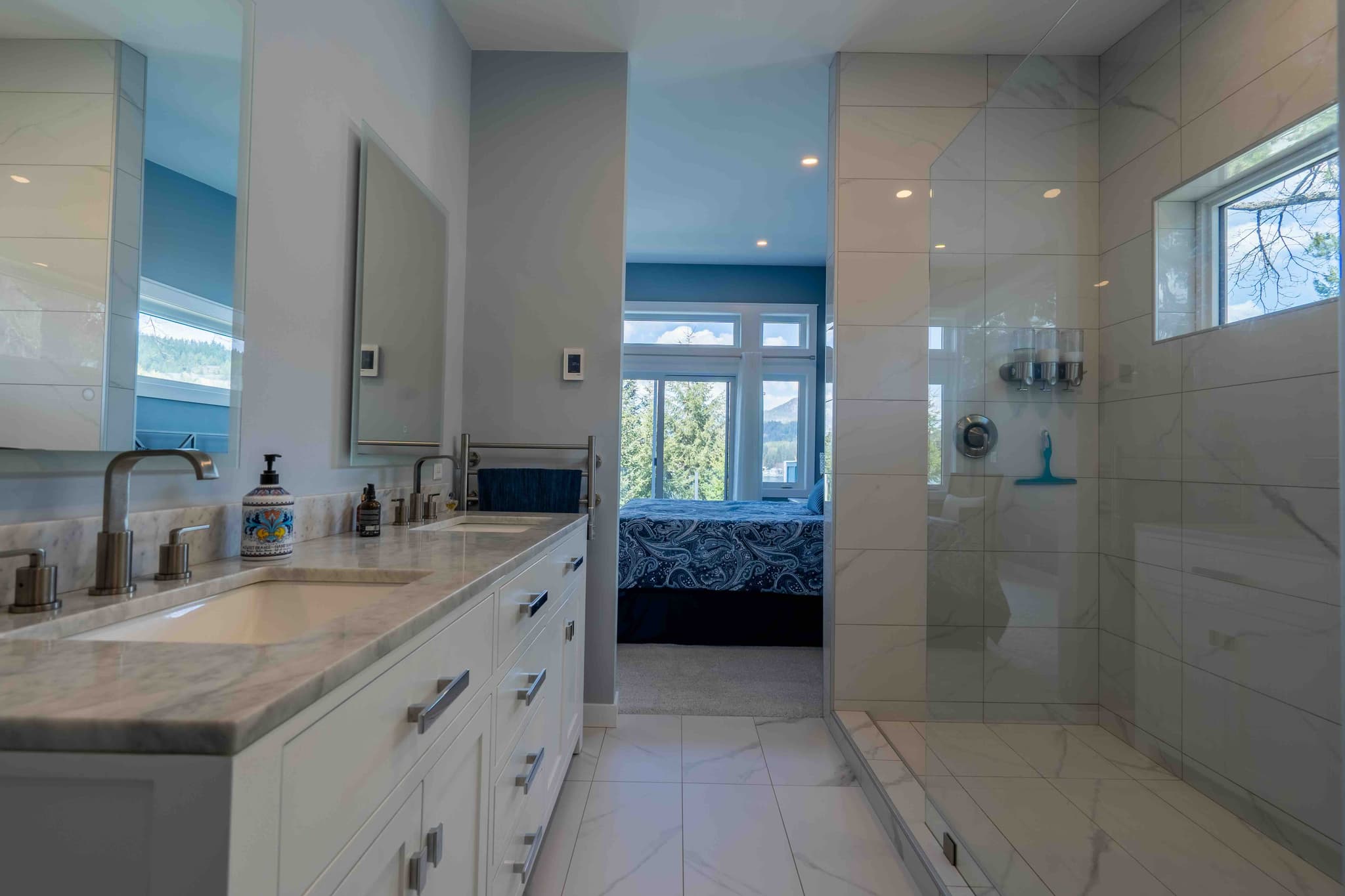 Master bathroom suite with double vanity and walk-through to bedroom